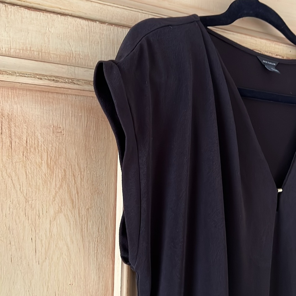 Ann Taylor top size L. Short cuff sleeve. Metal embellishment at v-neck.